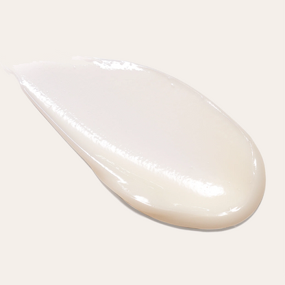 L'ANZA hair treatment cream texture shown on a light background
